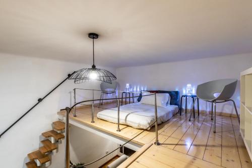 a bedroom with a bed and a table and chairs at I_Like_Sassari Apartment2.0 in Sassari