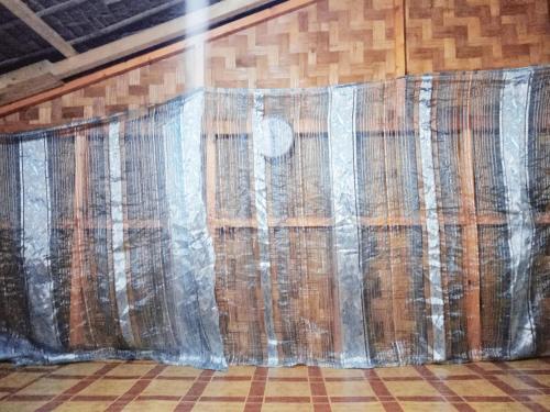 a wall covered in plastic in a room at SECLUDED GLAMPING YOGA SAMADHI fan 2 kubos 8 pax in Rimus