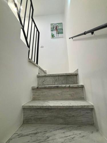 a staircase in a house with a picture on the wall at La casa di Stella in Isernia