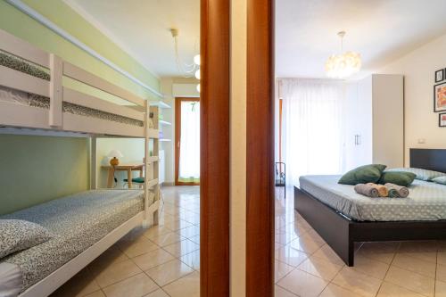 Postel nebo postele na pokoji v ubytování San Marco Bed&Garden