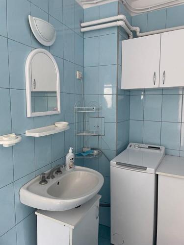 a bathroom with a sink and a toilet at Góbé Vendégház in Sovata