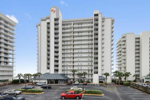 a parking lot in front of a large building at Windward Pointe 1401-Large balcony best views in Orange Beach