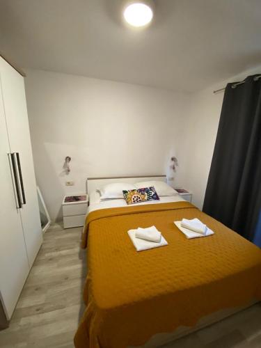 Postel nebo postele na pokoji v ubytování Apartmani Roko