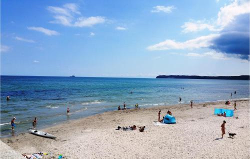 a group of people on a beach near the water at 2 Bedroom Stunning Apartment In Prora in Streu