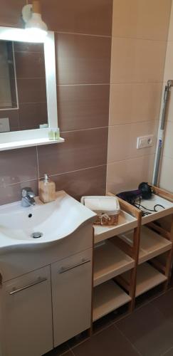 a bathroom with a sink and a mirror at Astralis in Trogir