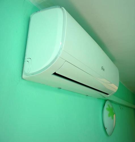 a white computer mouse hanging from a ceiling at Terres de l'Ebre experience in Ulldecona