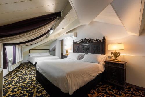 Postel nebo postele na pokoji v ubytování Hotel Doriguzzi