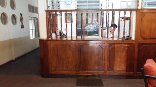 a wooden cabinet in a room with at Hotel Centenario in Guatemala