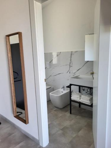a bathroom with a tub and a sink and a mirror at Casa MaLa’ in Ceprano