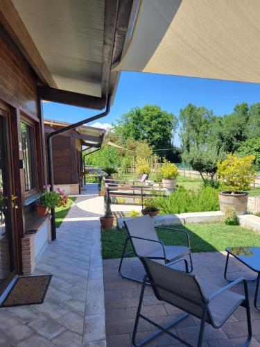 a patio with two chairs and a table at Casa MaLa’ in Ceprano