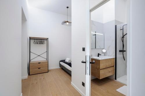 a bathroom with a sink and a mirror at 3 - Grand Appartement dans Château & Domaine privé à 15min de Lyon in Vourles