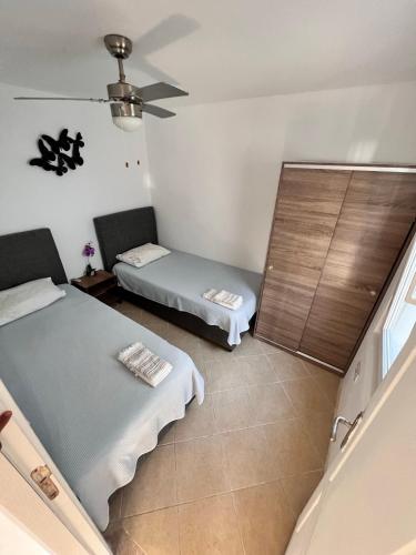 Ένα ή περισσότερα κρεβάτια σε δωμάτιο στο Bodrum Yalıkavak Villa