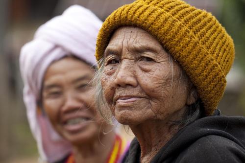 an older woman wearing a hat and looking at something at Kanlaya's Eyrie, Luxury Homestay in Pang Mapha