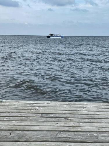 a boat in the middle of the ocean at Modern Home on Mille Lacs Lake! Amazing yard and game-room! in Garrison