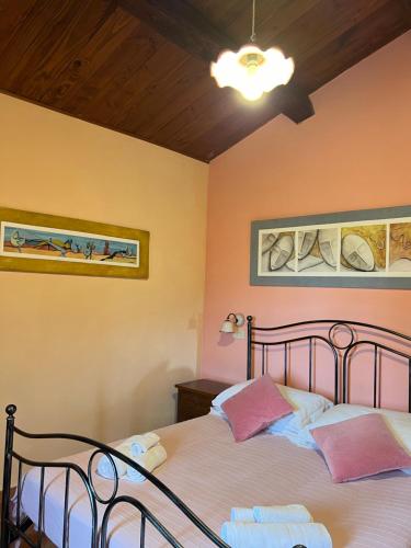 Postel nebo postele na pokoji v ubytování Agriturismo Melodie Toscane Sorano