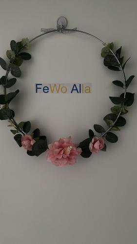 a wreath of flowers and a sign that reads fyno africa at Alla Deluxe in Gotha