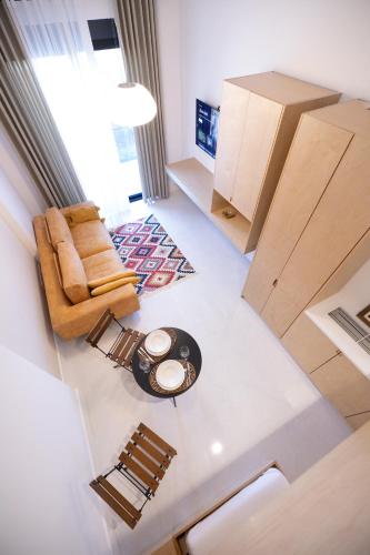 an overhead view of a living room with a table and chairs at Seaside Residence in Vlorë