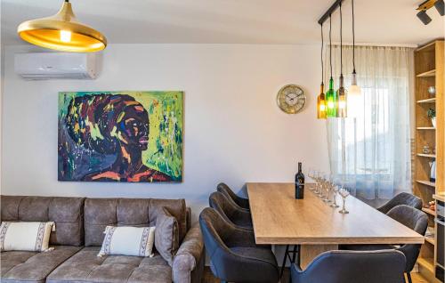 a living room with a couch and a table at Beautiful Apartment In Seget Donji in Seget Donji