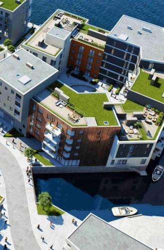 an overhead view of a building with a green roof at Møblert ferieleilighet i det fineste stedet i byen in Kristiansand