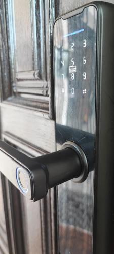 a close up of a doorhandle to a window at ZAGORA HILLS Premium Apartman SELF CHECK-IN, FREE PARKING in Krapina