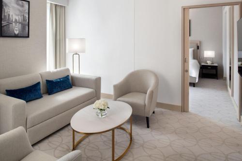 a living room with a couch and a table at JW Marriott Hotel Marina in Dubai