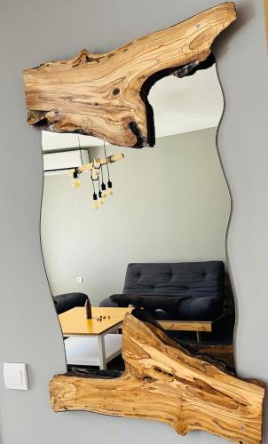a living room with a large piece of drift wood at Boris’s Guest Apartment in Chepelare