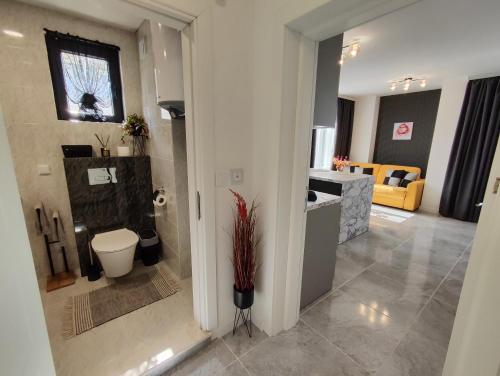a bathroom with a toilet and a sink at студио Водолей in Obzor