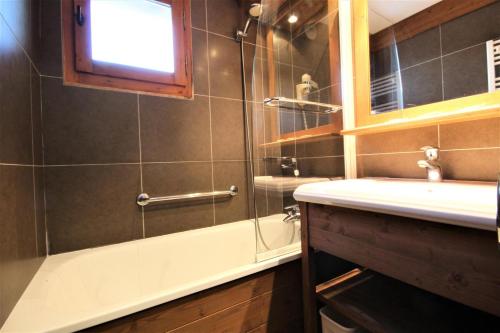 a bathroom with a shower and a sink and a mirror at Le Chalet De Montchavin - Magnifique appartement rénové MAE-4234 in La Plagne Tarentaise