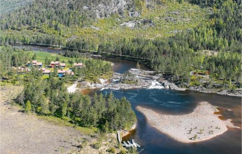 an aerial view of a river with houses and trees at Ulv - Hytte 3 in Øvre Ramse