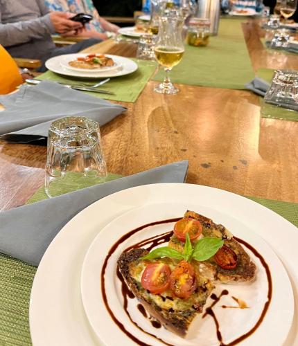 a white plate with a piece of food on a table at Southern Drake Lodge in Drake
