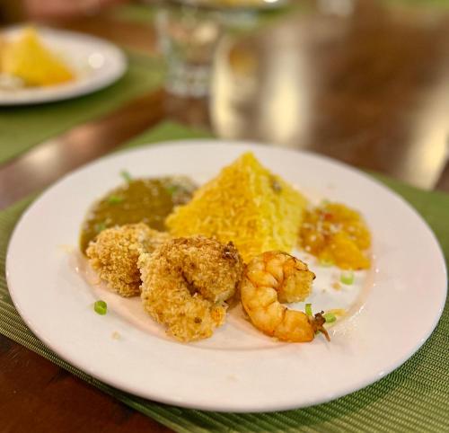 a plate of food with shrimp on a table at Southern Drake Lodge in Drake