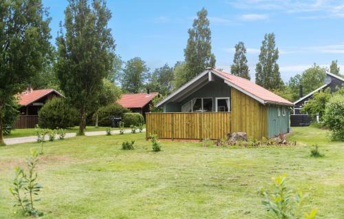 a house in a field with a yard at Nice Home In Hovborg With Wifi in Hovborg