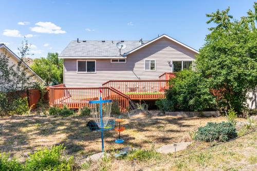 a yard with a playground in front of a house at Spacious home, gameroom, 9mi GEG, 5mi downtown, 5mi to hospitals, close to all universities in Spokane Valley