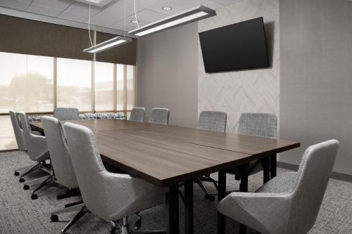 a conference room with a wooden table and chairs at Springhill Suites by Marriott Lexington Fritz Farm in Lexington