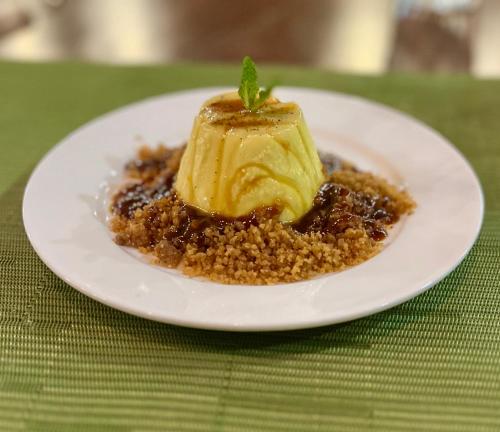 a white plate with a dessert on a table at Southern Drake Lodge in Drake