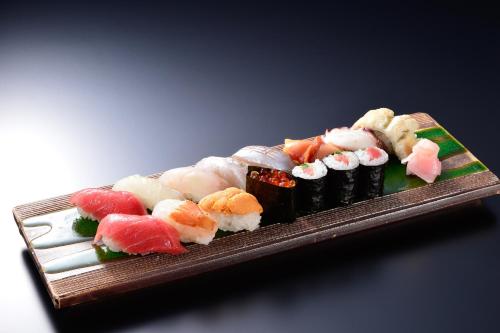 a plate of sushi on a table at Hakone Onsen Ryokan Yaeikan in Hakone