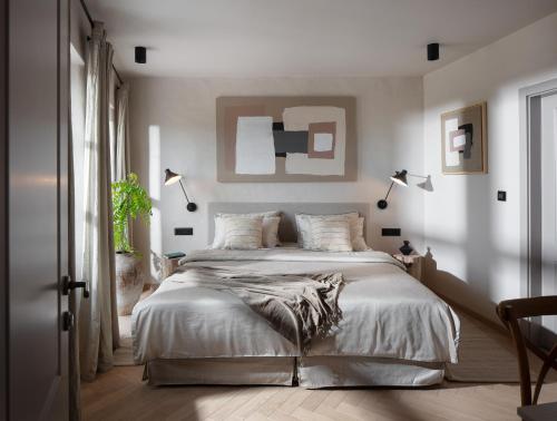a bedroom with a large bed and a window at Villa Motovun in Motovun