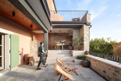 a man walking on the patio of a house at Villa Motovun in Motovun