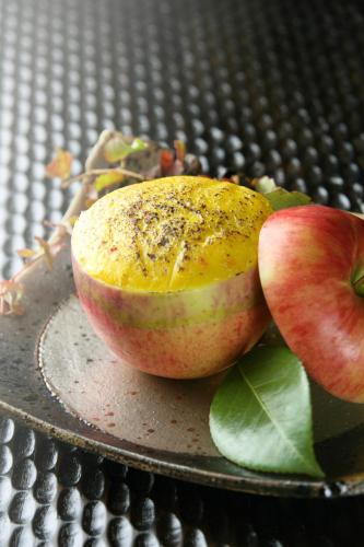 a close up of an apple on a plate at Hakone Onsen Ryokan Yaeikan in Hakone