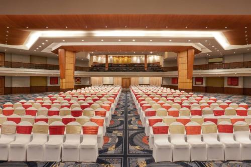 an empty banquet hall with rows of chairs at Hyderabad Marriott Hotel & Convention Centre in Hyderabad