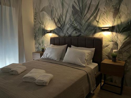 a bedroom with a bed with two towels on it at Oasis Apartment 2 by GG in Alexandroupoli