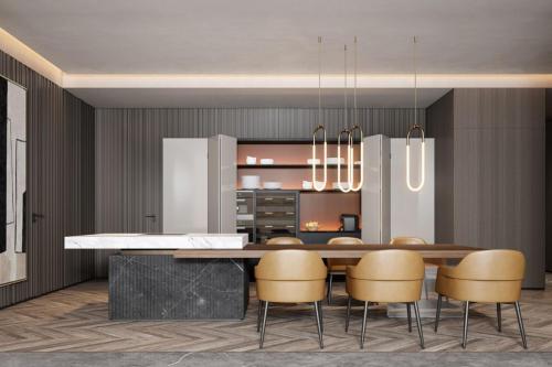 a kitchen and dining room with a table and chairs at Luoyang Marriott Hotel in Luoyang