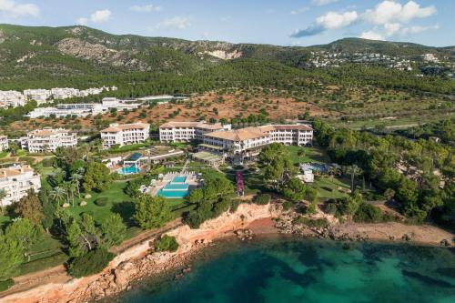 an aerial view of a resort on the beach at The St. Regis Mardavall Mallorca Resort in Portals Nous
