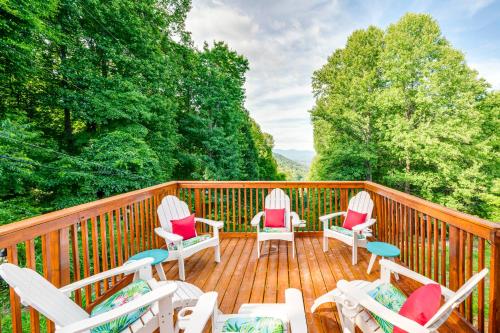 a deck with chairs and tables and trees at The Getaway Lodge in the Blue Ridge Mountains near Roanoke & Bedford in Troutville