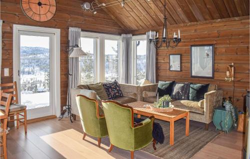 a living room with a couch and a table at 3 Bedroom Lovely Home In Nissedal in Kyrkjebygdi