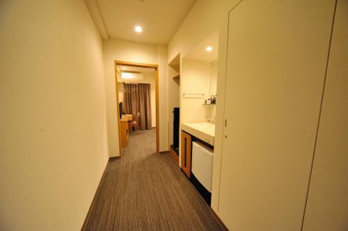 Voodi või voodid majutusasutuse Dormy Inn Express Meguro Aobadai Hot Spring toas