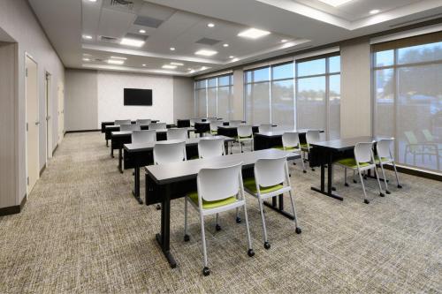 a classroom with tables and chairs in a room with windows at SpringHill Suites by Marriott Dothan in Dothan