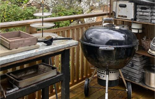 a large pot sitting on a grill on a deck at 3 Bedroom Awesome Home In Vallda in Vallda