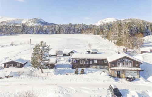 an aerial view of a house covered in snow at Lovely Home In Rysstad in Rysstad