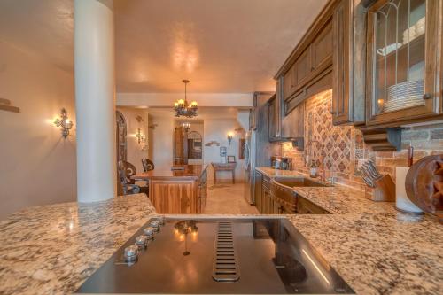 a kitchen with a sink and a counter top at Caribe Tesoro in West Bay